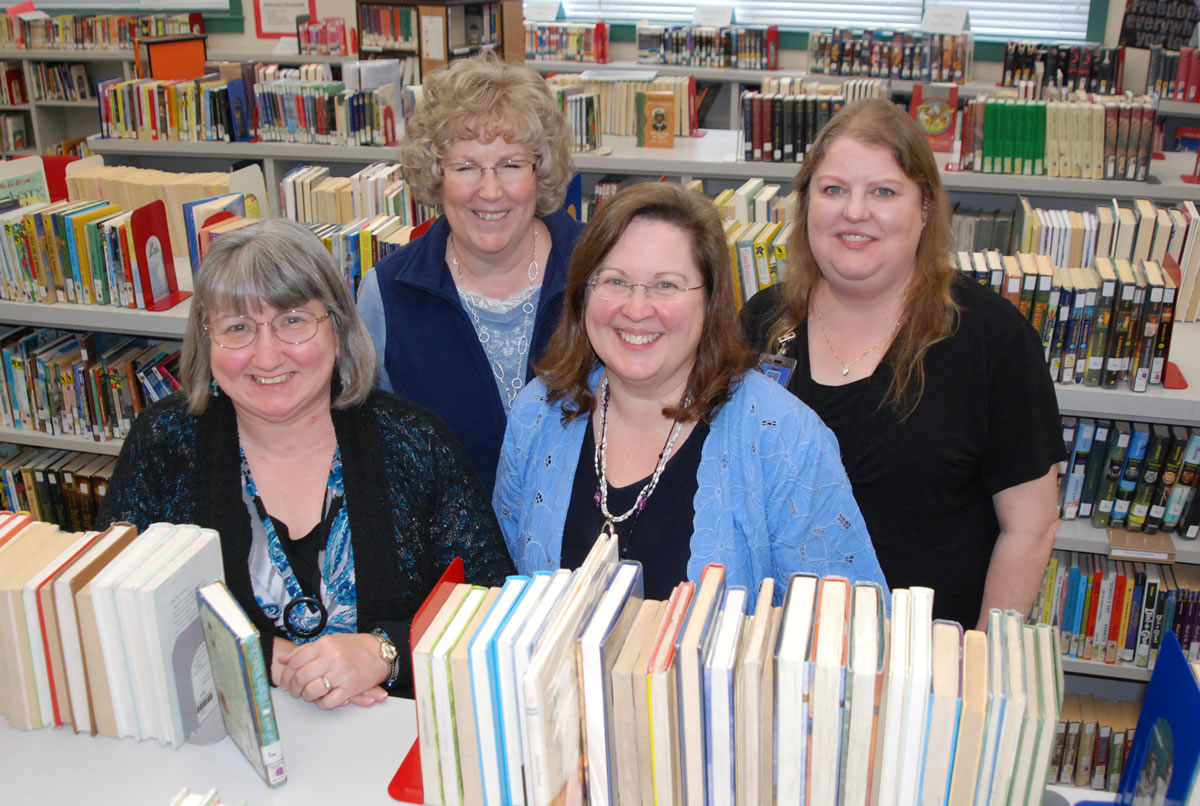 Contributed photo
Washougal elementary school librarians are happiest when surrounded by books.  They are (back row, left to right): Marlene Leifsen and Tammy Asbjornsen, (front row, left to right): Holly Vonderohe and Kathy Stanton.