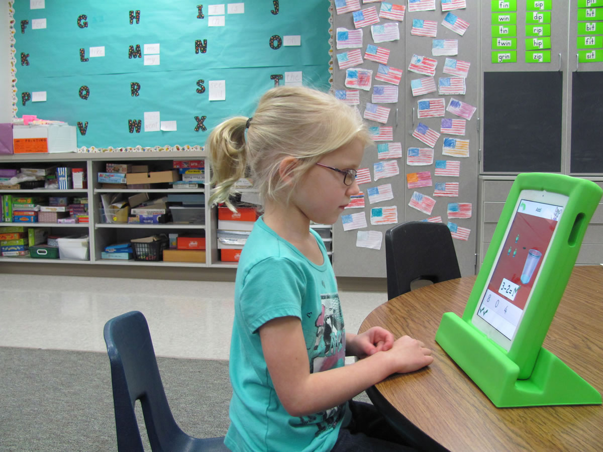 Addi Gibbons works with the &quot;Teach Me Kindergarten&quot; app on an iPad at Cape Horn-Skye Elementary School.