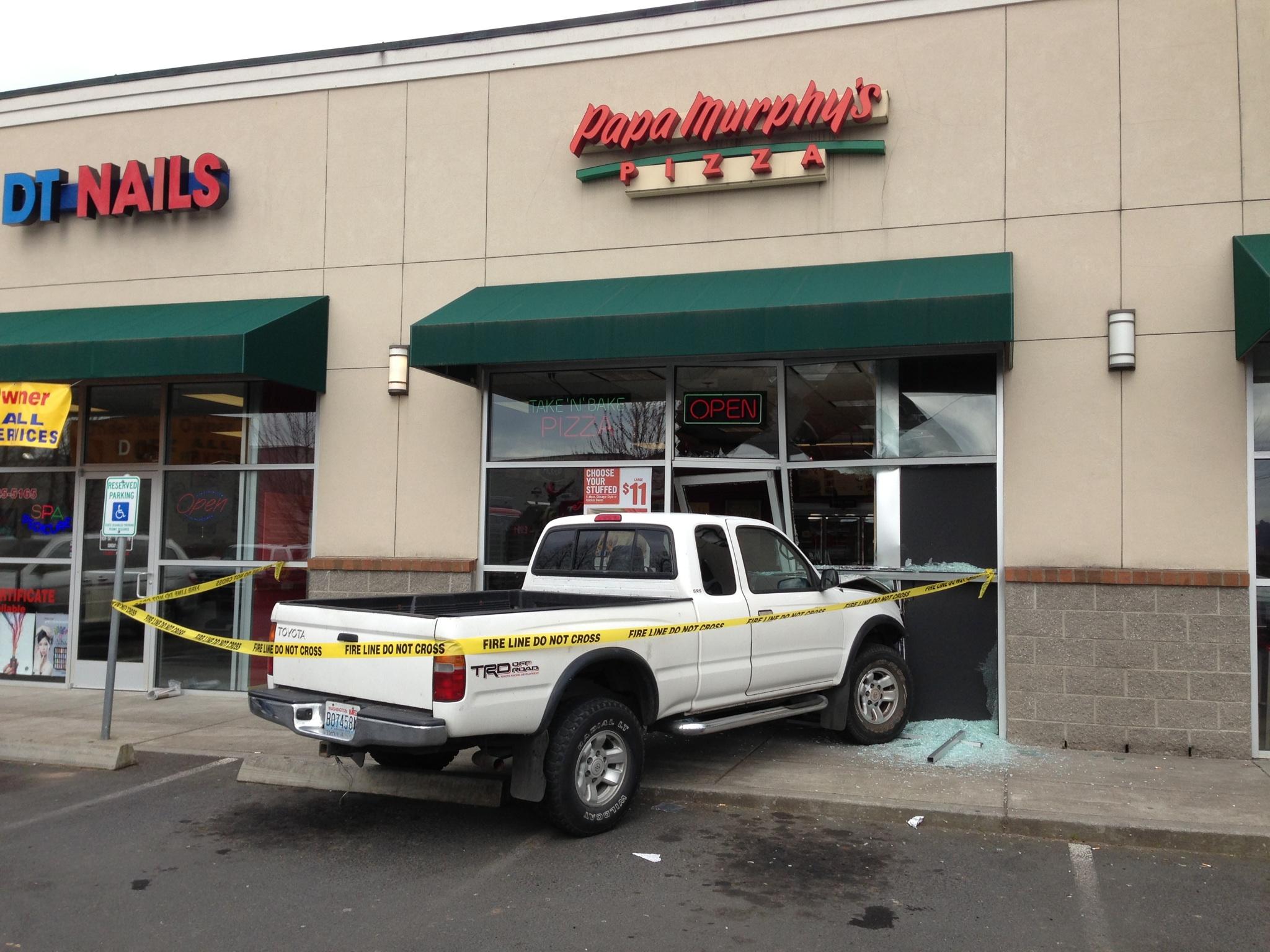 A Woodland teen accidentally drove his pickup truck into a Papa Murphy's just before noon Wednesday.