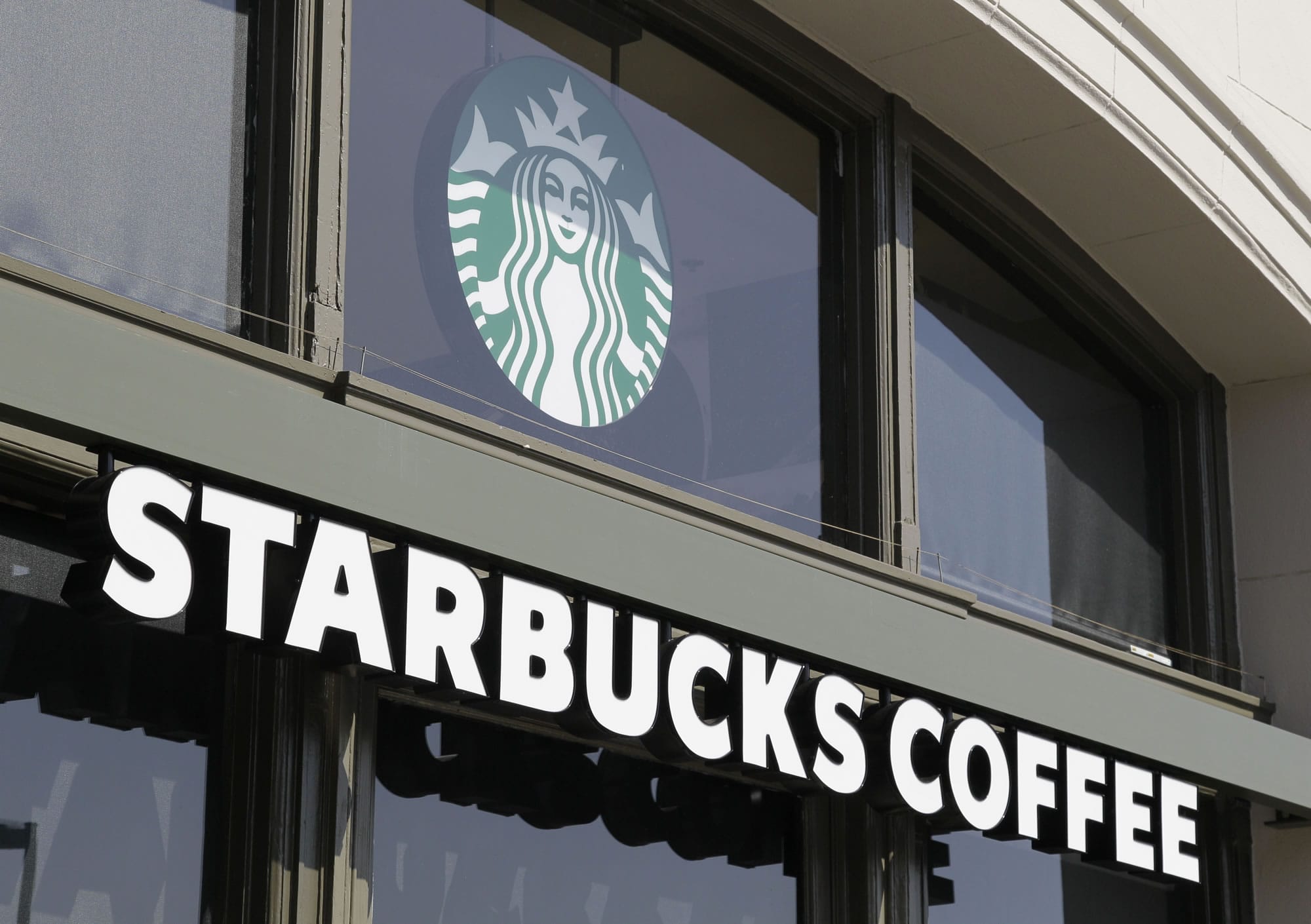 Seattle coffee chain Starbucks has asked that patrons not bring guns inside its cafes, though it has stopped short of a ban.