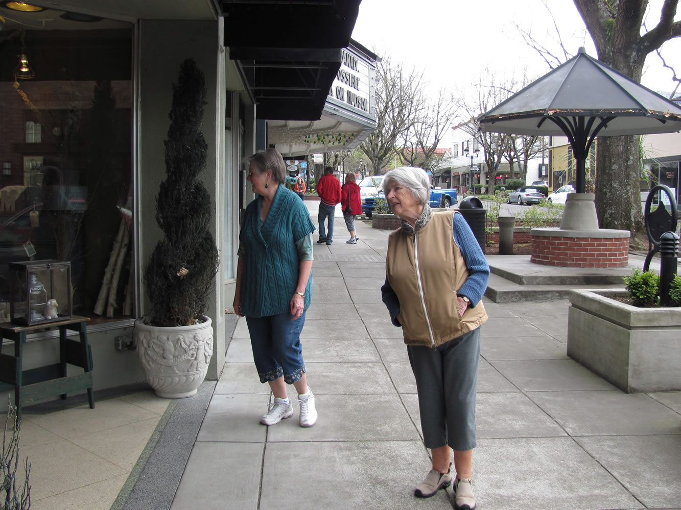Annice Sampson (left) and Edith Arndt (right) admire the windows of Camas Antiques, next to the Liberty Theatre. The longtime friends walk together four days a week through their Camas neighborhood and into the downtown business core.