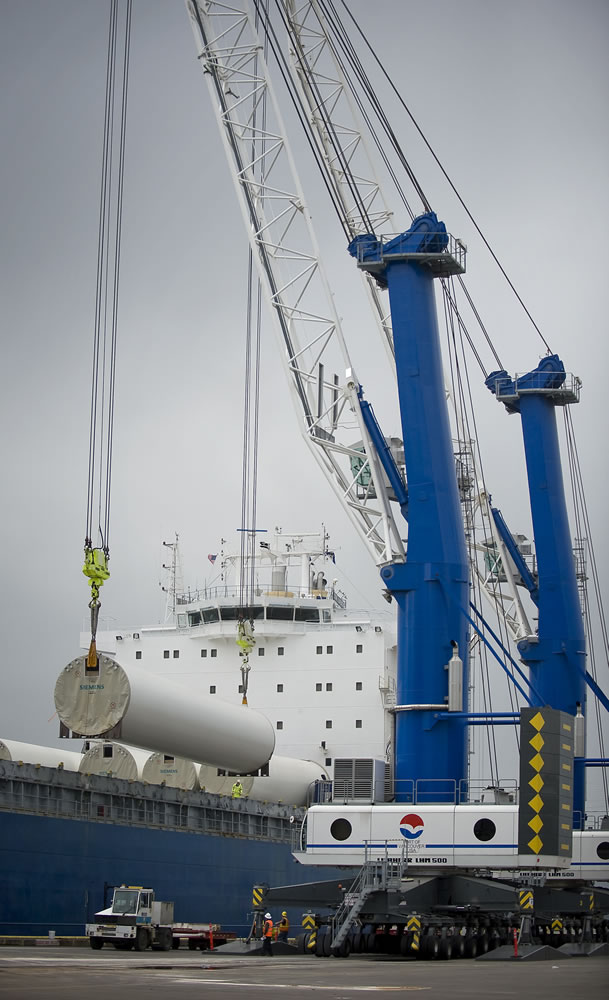 Cranes off-load wind energy components at the Port of Vancouver in 2011.