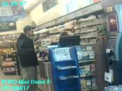 Police are looking for this man, suspected of stealing a woman's wallet and making fraudulent charges on her bank card.