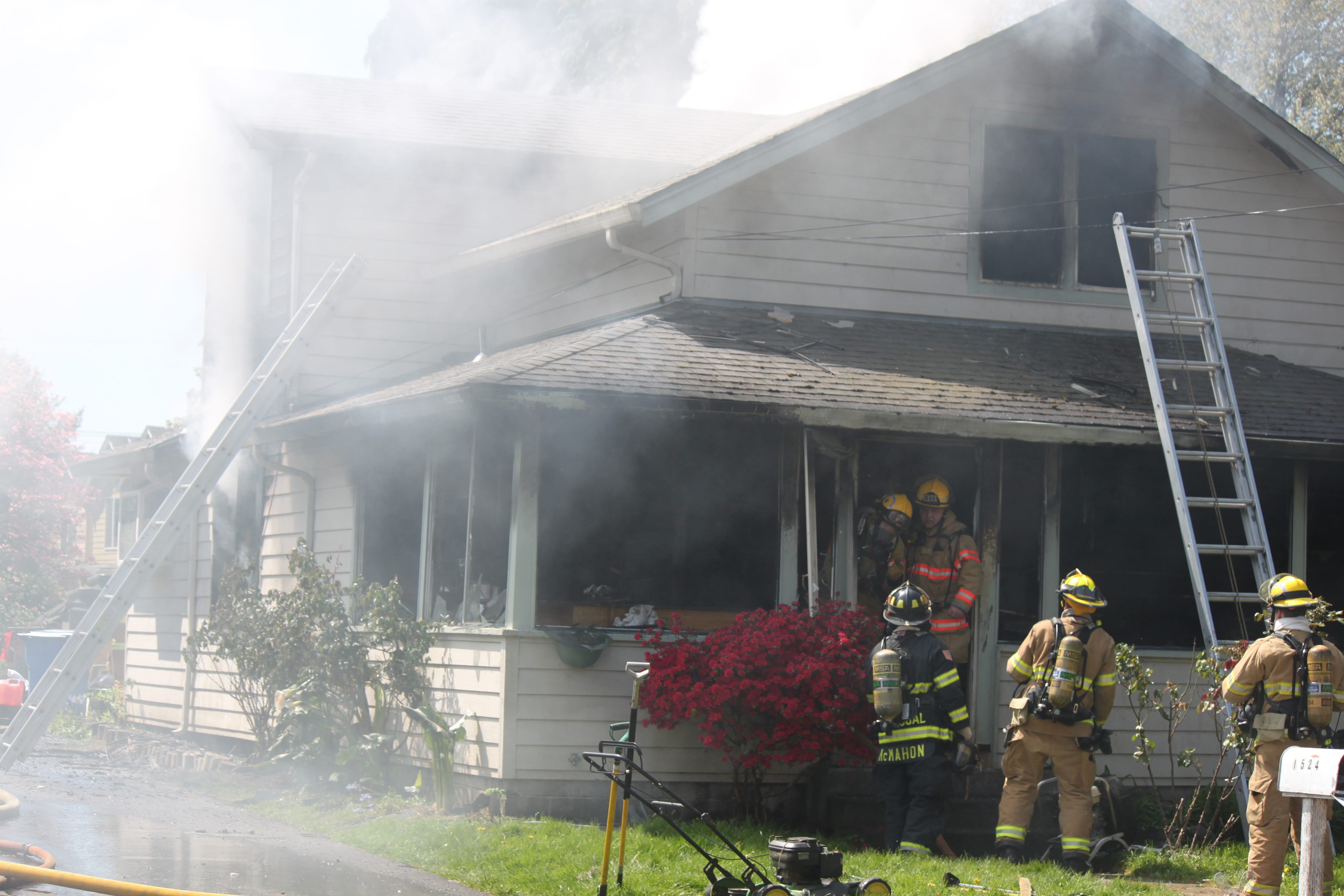 Emergency crews work to put out a house fire at 1524 S.E. Seventh Ave., in Camas. Firefighters from Camas, Washougal and East County Fire and Rescue were dispatched at approximately 11:30 a.m.