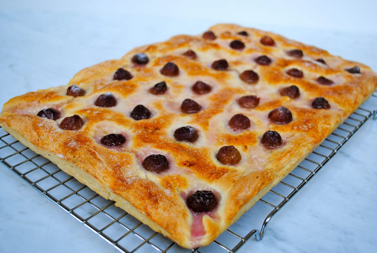 Focaccia topped with grapes and a sprinkle of salt has a crunchy crust and a balance of sweet and savory flavors.
