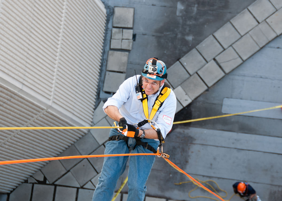 Lenny Bernstein rappels down the side of a Hilton hotel in the Special Olympics Over the Edge fundraiser event in Arlington, Va.