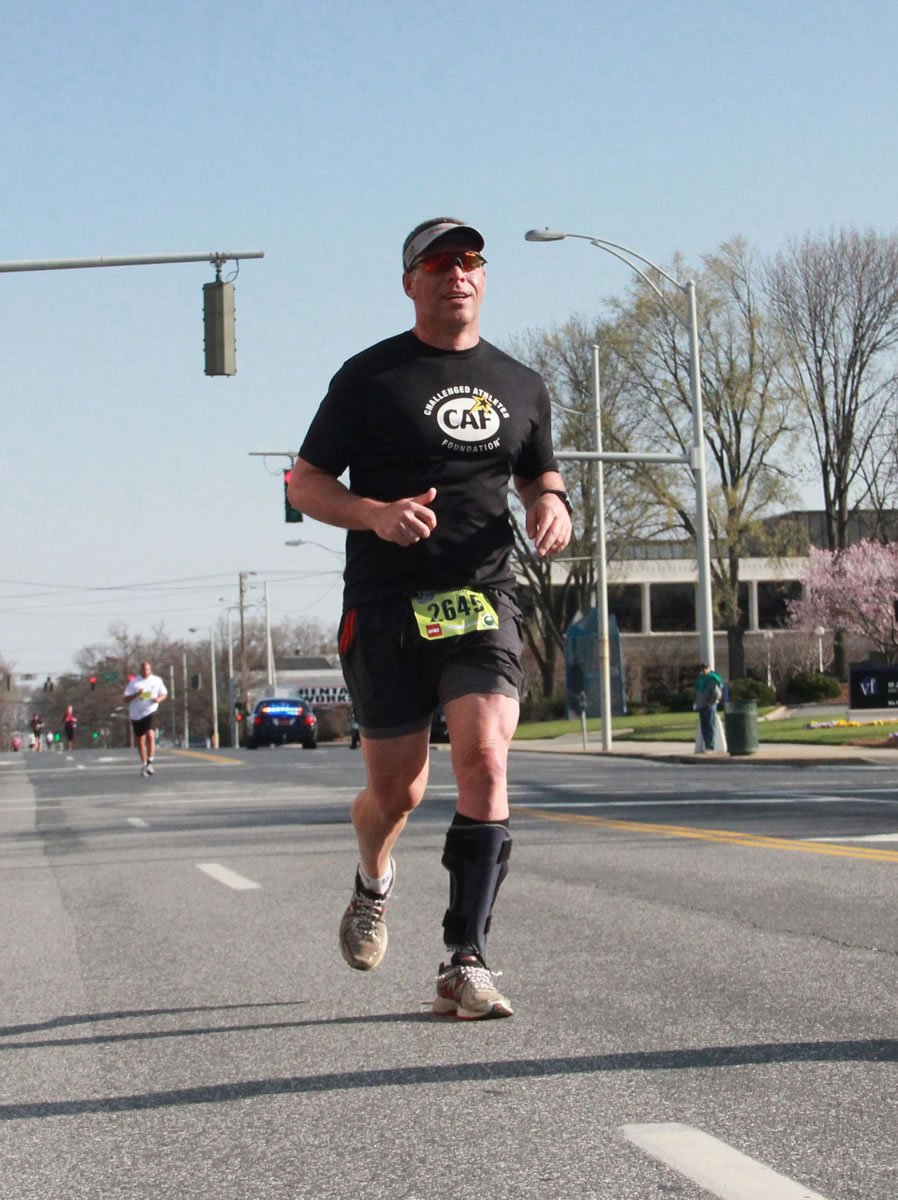 Photo by Phillip Yeary
Dr. Darren Smith, of Camas, ran in the Greensboro BB&amp;T Gate City 8K, in North Carolina, in April. It was the inaugural event for &quot;TeamUP,&quot; which consists of eight people who have paralysis in one or both of their legs as a result of foot drop. The members have overcome their mobility issues with orthotic devices made by Allard USA. Smith, 47, plans to participate in the Rock 'n' Roll Portland Half Marathon Sunday.
