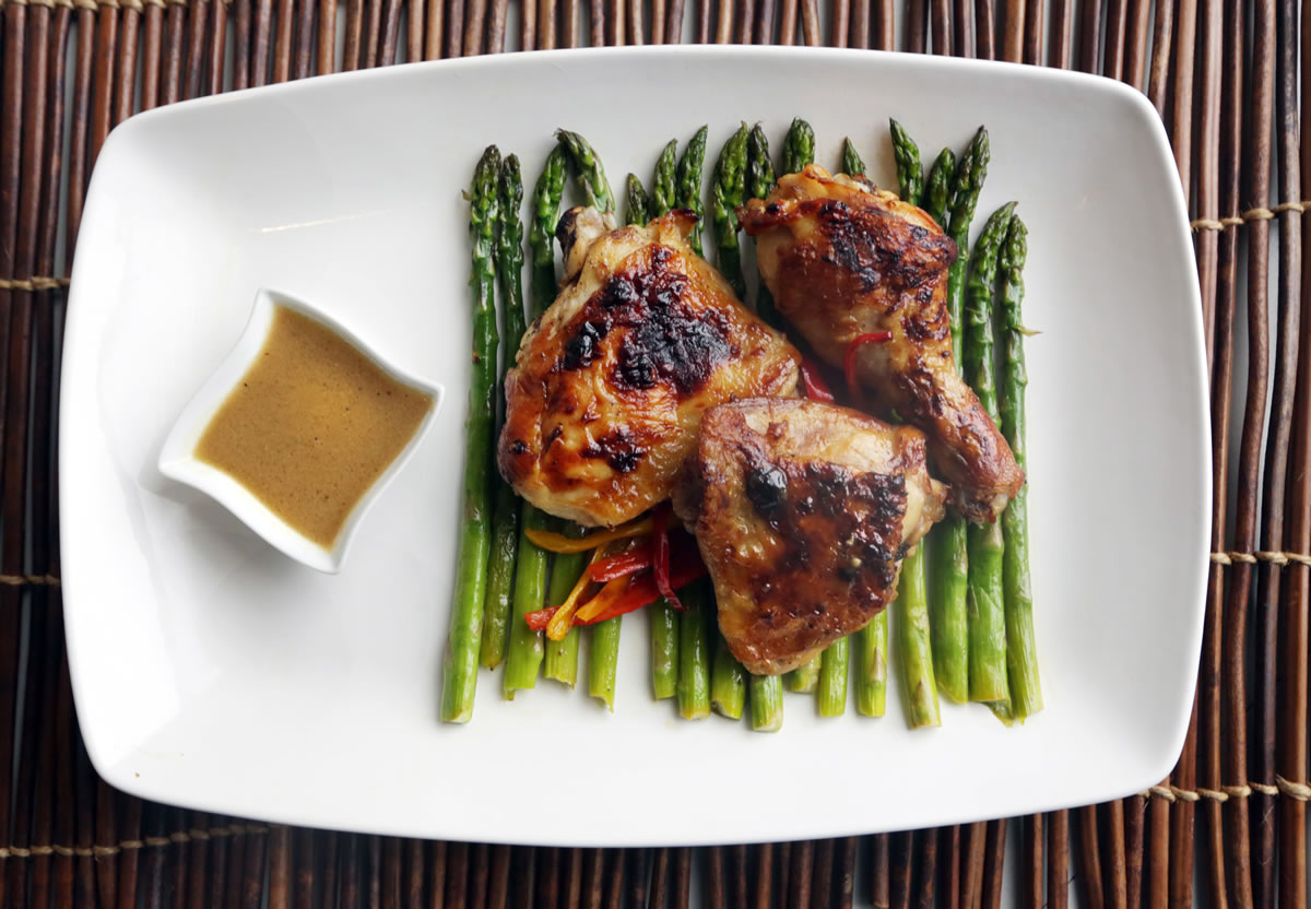 Fresh lemons, olive oil and Dijon mustard are paired with chicken, asparagus and sweet mini bell peppers in this dish.