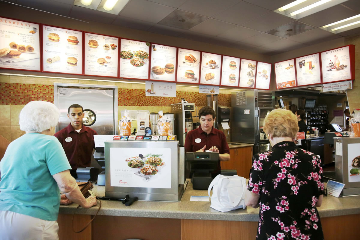 Photos by George Skene/Orlando Sentinel
This Chick-fil-A in Orlando, Fla., has menus with caloric values. McDonald's and Panera have done the same. Grocers are fighting a federal requirement to post calories for food made at stores, such as sandwiches.