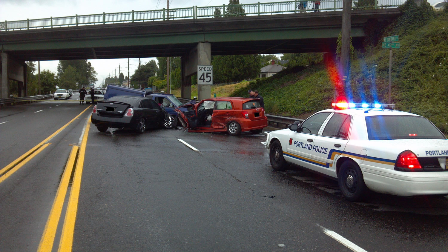 Portland Police investigate a crash of three vehicles on Northeast Lombard Street near the 42nd Avenue overpass. A westbound Nissan pickup, driven by Jesse Dean Rankin, 29, of Camas, crossed the center line and hit a Toyota sedan driven by Carrie Ann Hill, 36, of Vancouver, and a Nissan sedan whose driver was not identified.