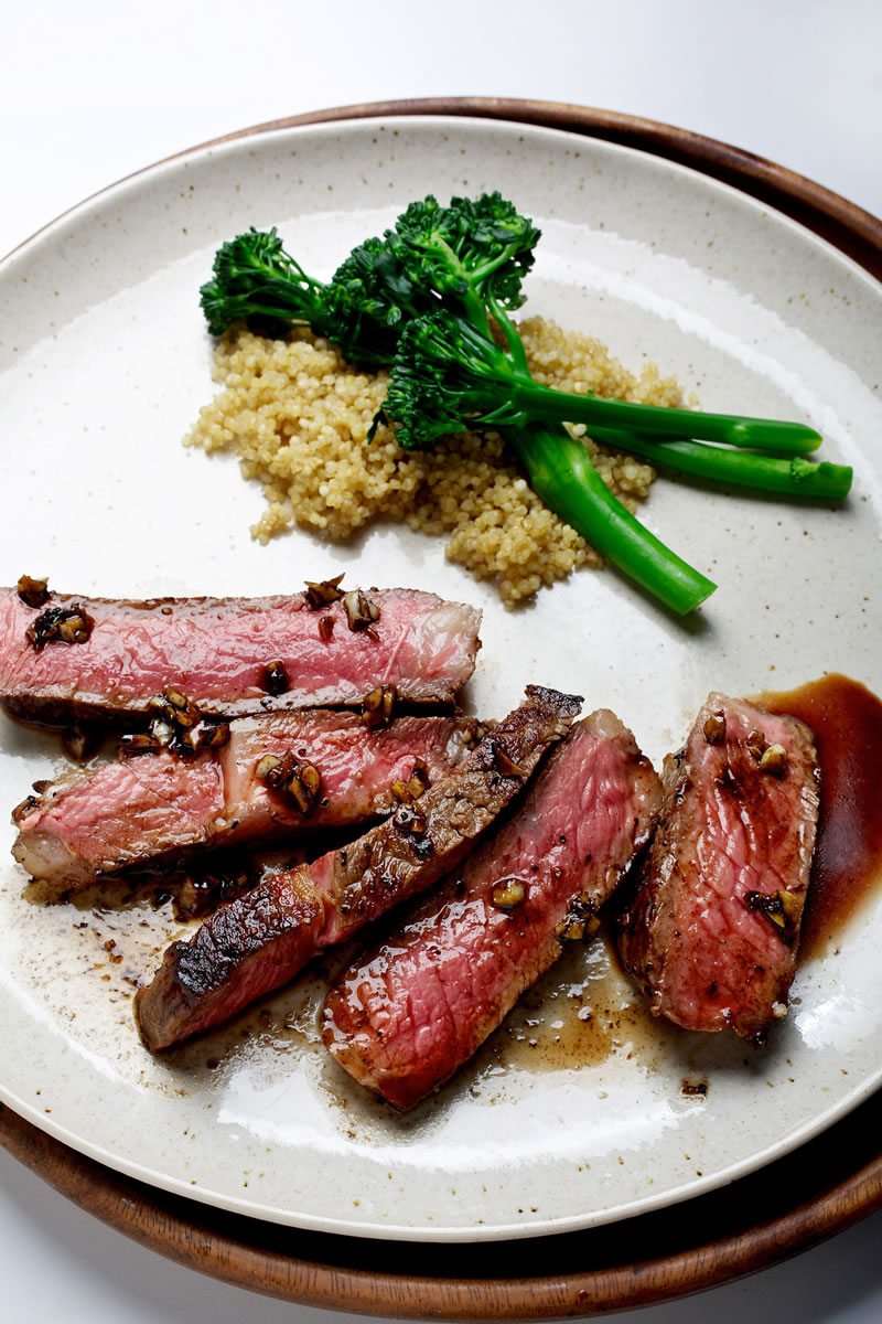 Pan-Seared Garlic Rib-Eye Steak can help light up a weeknight meal.