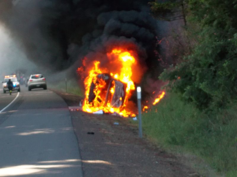 A 2010 Toyota Camry burns at the side of Interstate 84 eastbound near Cascade Locks on Monday.