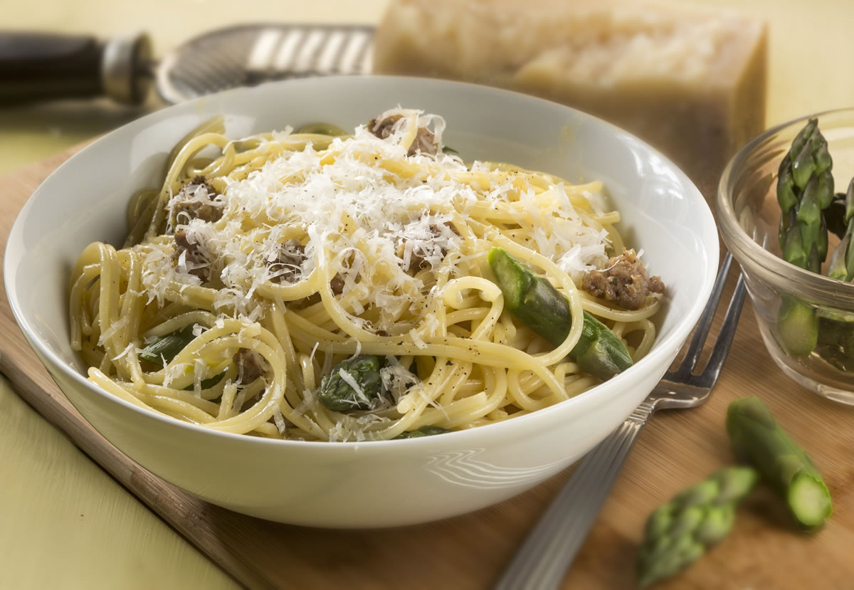 While not fitting the ingredient list for traditional carbonara, this version with Italian sausage and pea shoots makes a quick dinner and uses what is on hand.