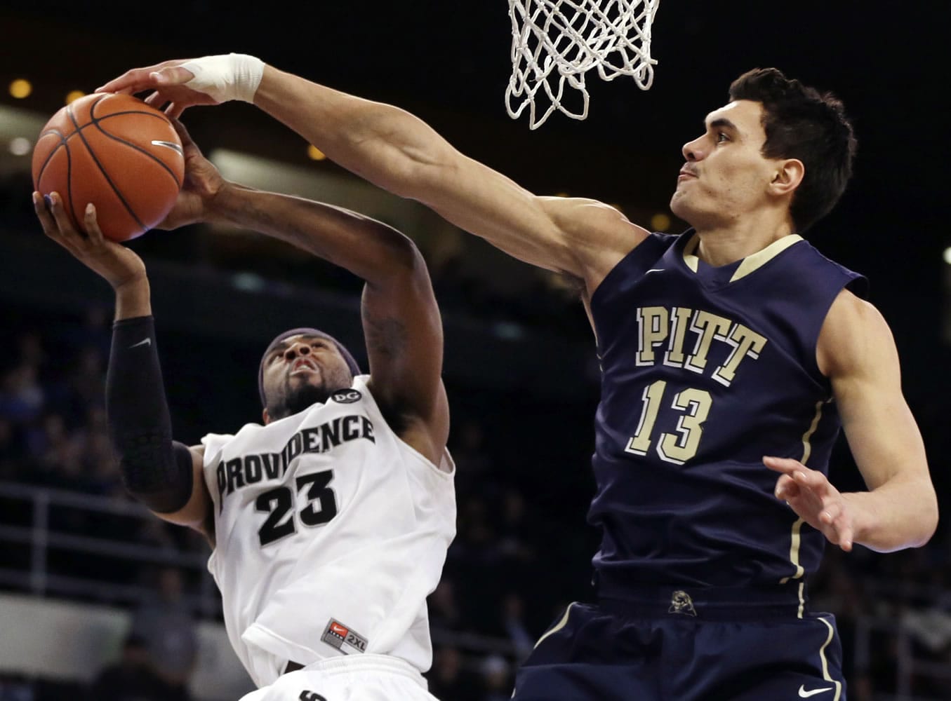 Pittsburgh center Steven Adams (13), blocking a shot by Providence forward LaDontae Henton (23), is a possible first round pick in the NBA Draft on Thursday.