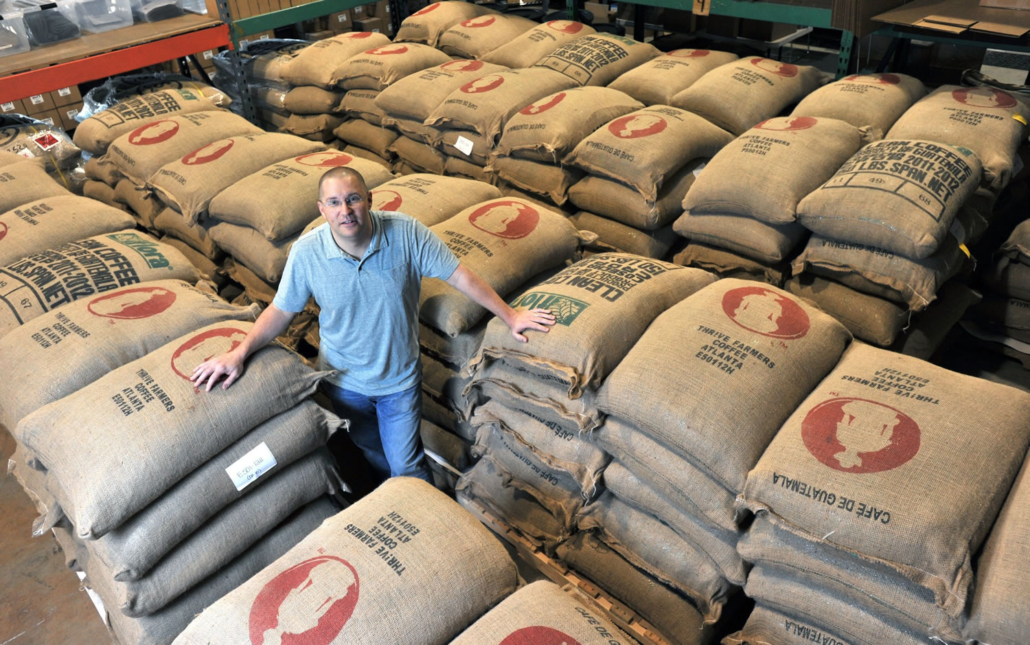 Michael Jones, founder of Thrive Farmers Coffee, stands at a warehouse of Thrive Farmers Coffee in Roswell, Ga., on June 13.