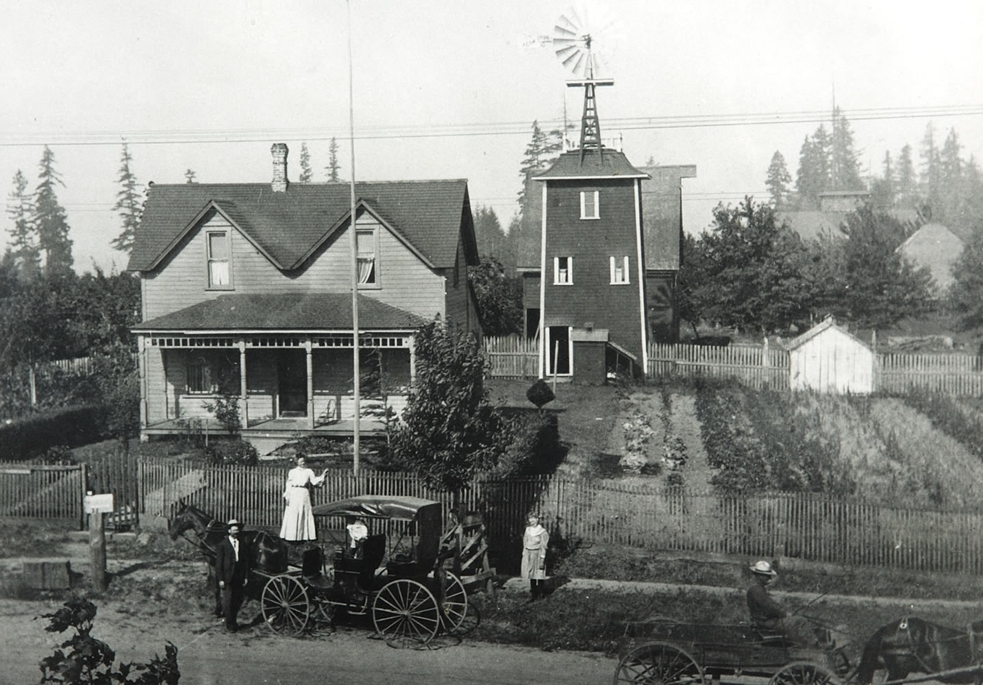 Felida: This photograph of Erickson Farms was taken in 1905, just a few years after the place was established. Standing on the walk near the center of the frame is Ruth Anderson, mother of Vinton Erickson.