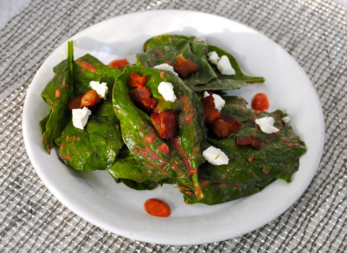 Spinach leaves catch and hold dressing in their folds in this Spinach Salad With Warm Strawberry-Rhubarb Dressing.