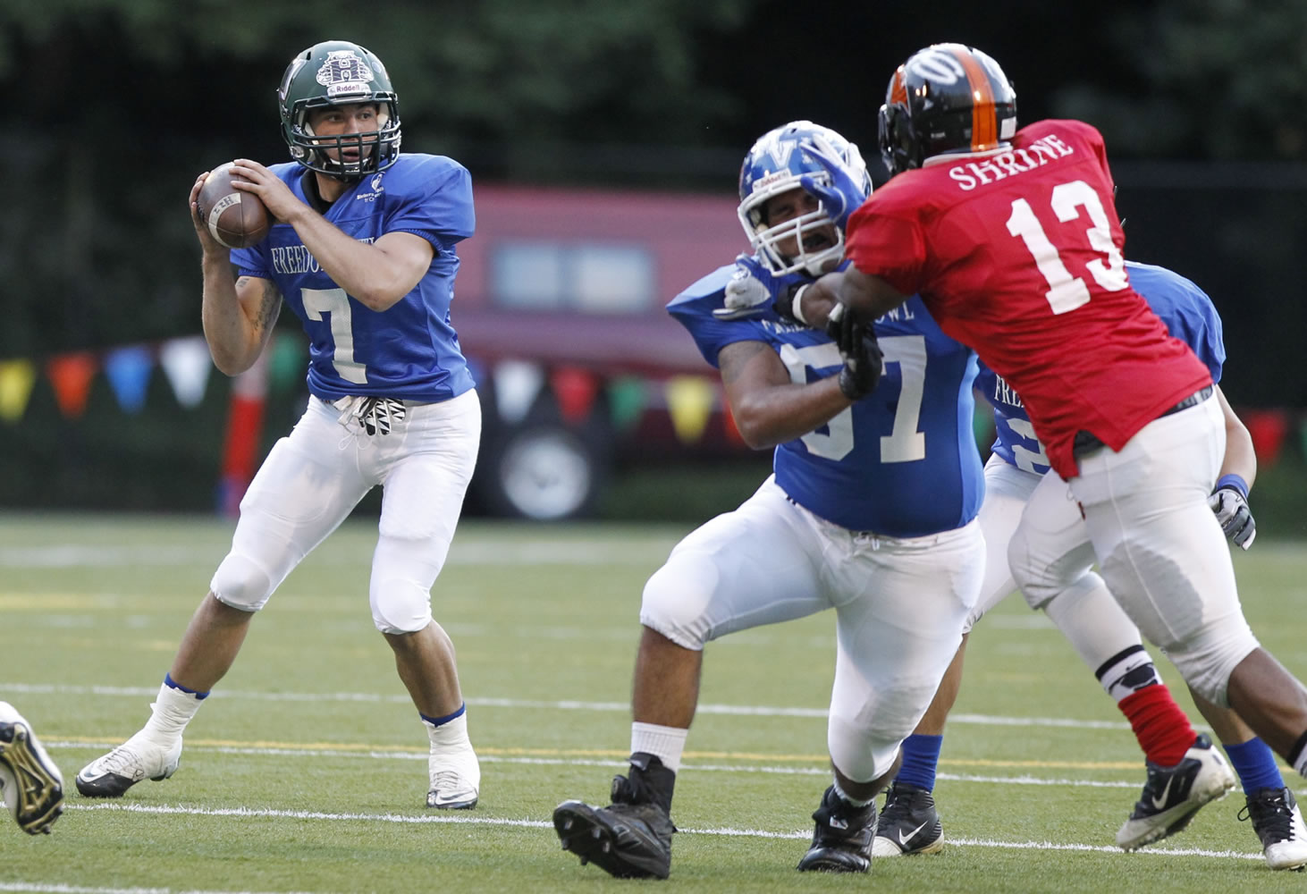 East quarterback Anthony Thomas of Evergreen drops back to pass during Freedom Bowl at Kiggins Bowl.