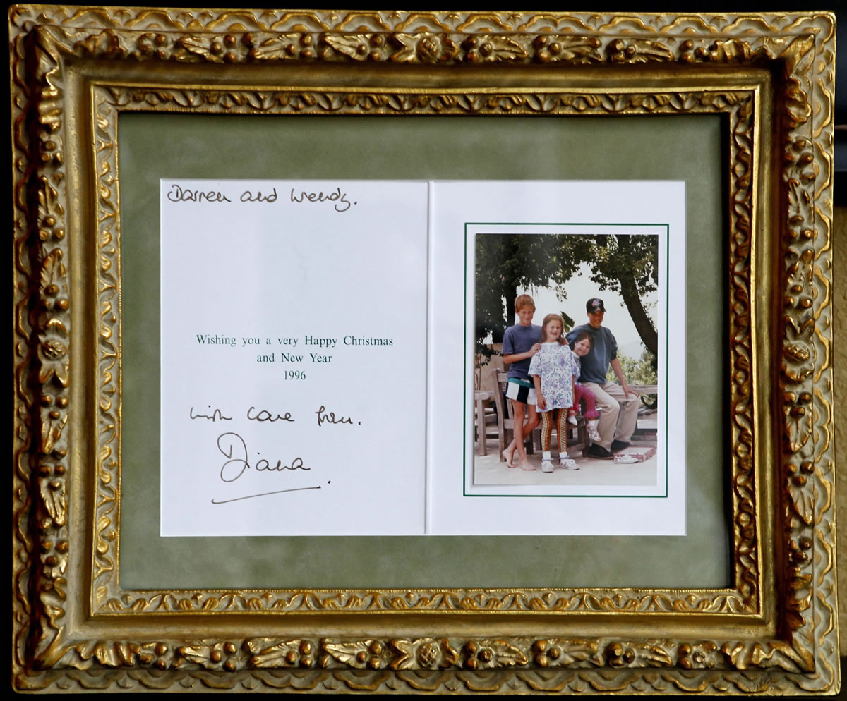 A Christmas card from the Royal children to Darren McGrady and his wife from Princess Diana in 1996 is shown. McGrady, who cooked at the palace for Prince William and Prince Harry when he was Princess Diana's personal chef, at his Plano, Texas, home, Wednesday, June 19, 2013.