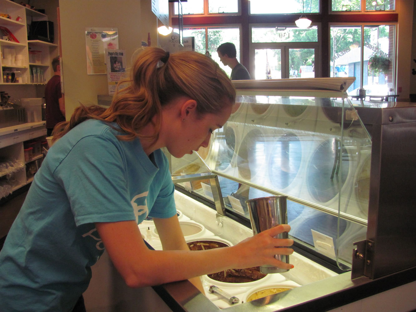 Photos by Danielle Frost/Post-Record
Lacey Little prepares a treat for a customer at Papa's Ice Cream in Washougal. She attends the University of Oregon and works at the store during school breaks and summer vacations.