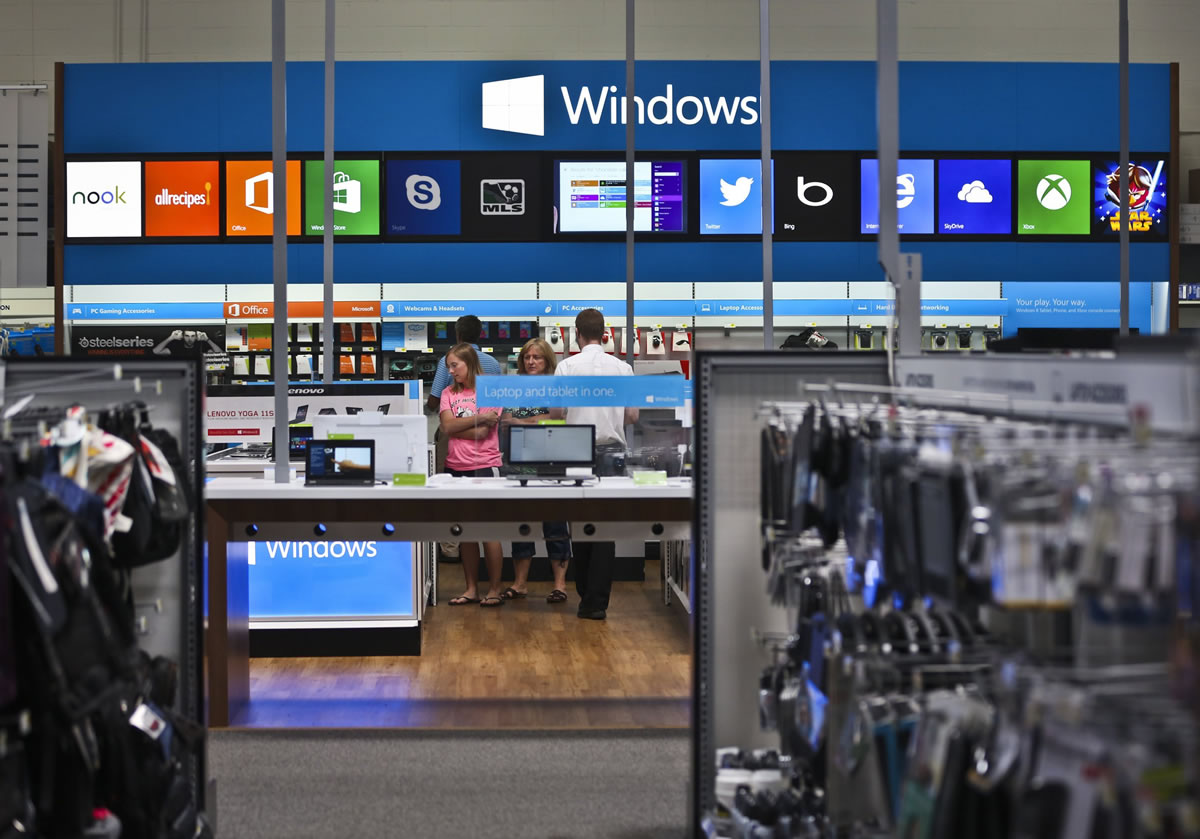 Customers browse the Windows Store inside the Best Buy in Richfield, Minn.
