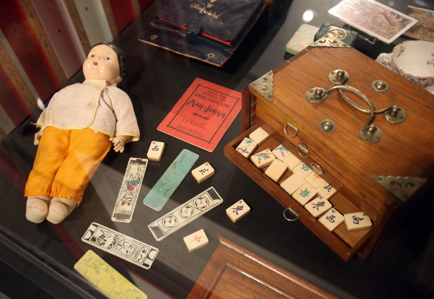 A mahjong set and doll from the 1920s are part of an exhibit, &quot;Project Mah Jongg,&quot; at the William Breman Jewish Heritage and Holocaust Museum in Atlanta that runs through Sept.