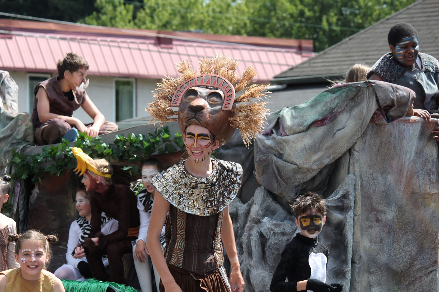 Members of Christian Youth Theatre dressed up in elaborate costumes worn during their recent performance of &quot;Pridelands.&quot; The group belted out a number of tunes as they walked the parade route on Fourth Avenue from Oak to Adams street.