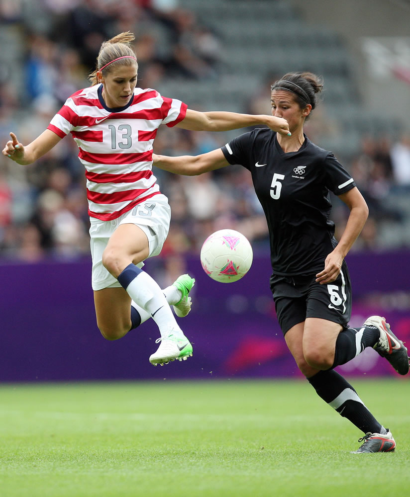 United States' Alex Morgan, left, vies for the ball with New Zealand's Abby Erceg, right, during their women's quarter-final soccer match at St James' Park in Newcastle, England, during the London 2012 Summer Olympics, Friday, Aug.