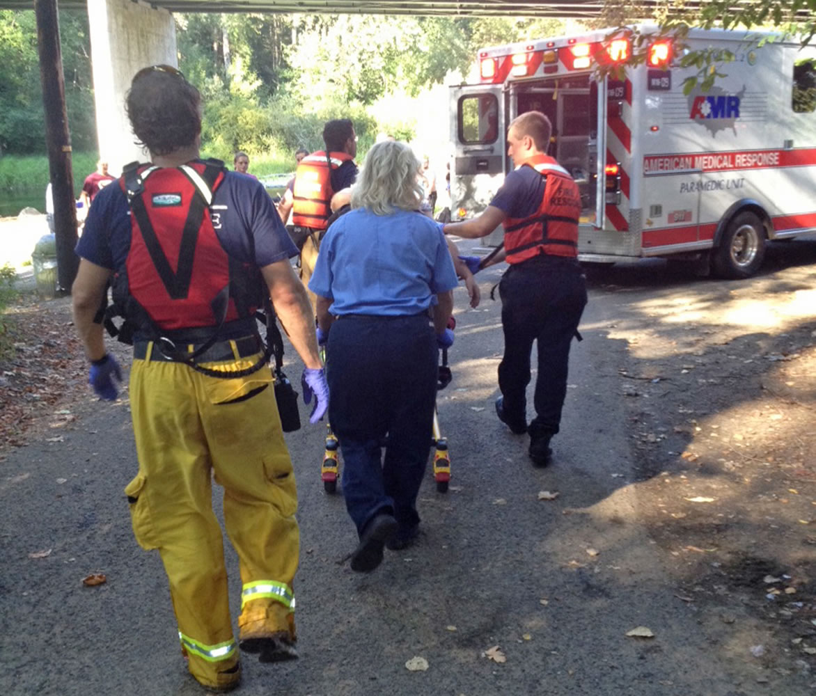 Firefighters tend to a 32-year-old man who was injured Sunday afternoon at Daybreak Park near Battle Ground.