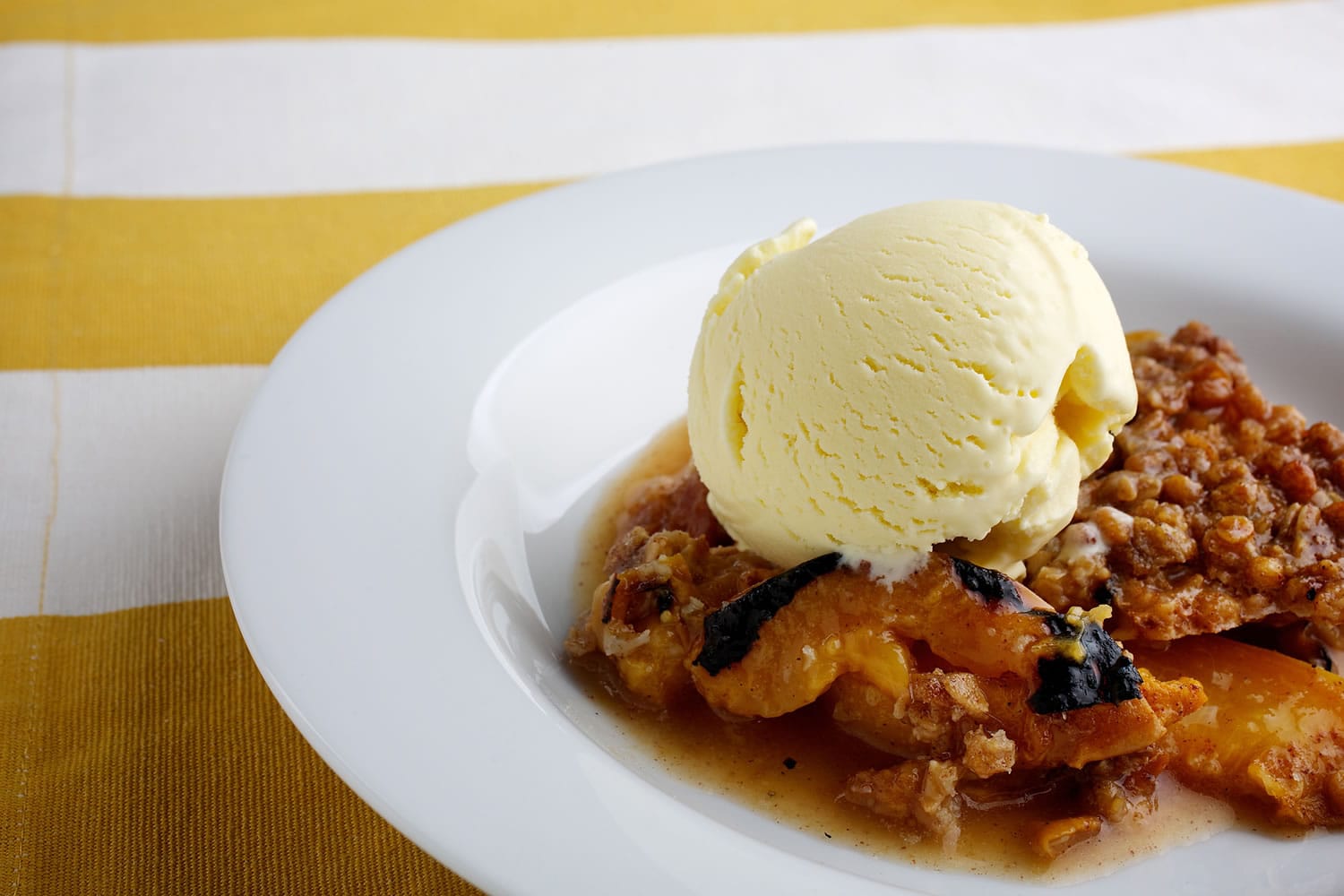 Grilled Peach Cobbler With Sage Sweet Corn Ice Cream.
