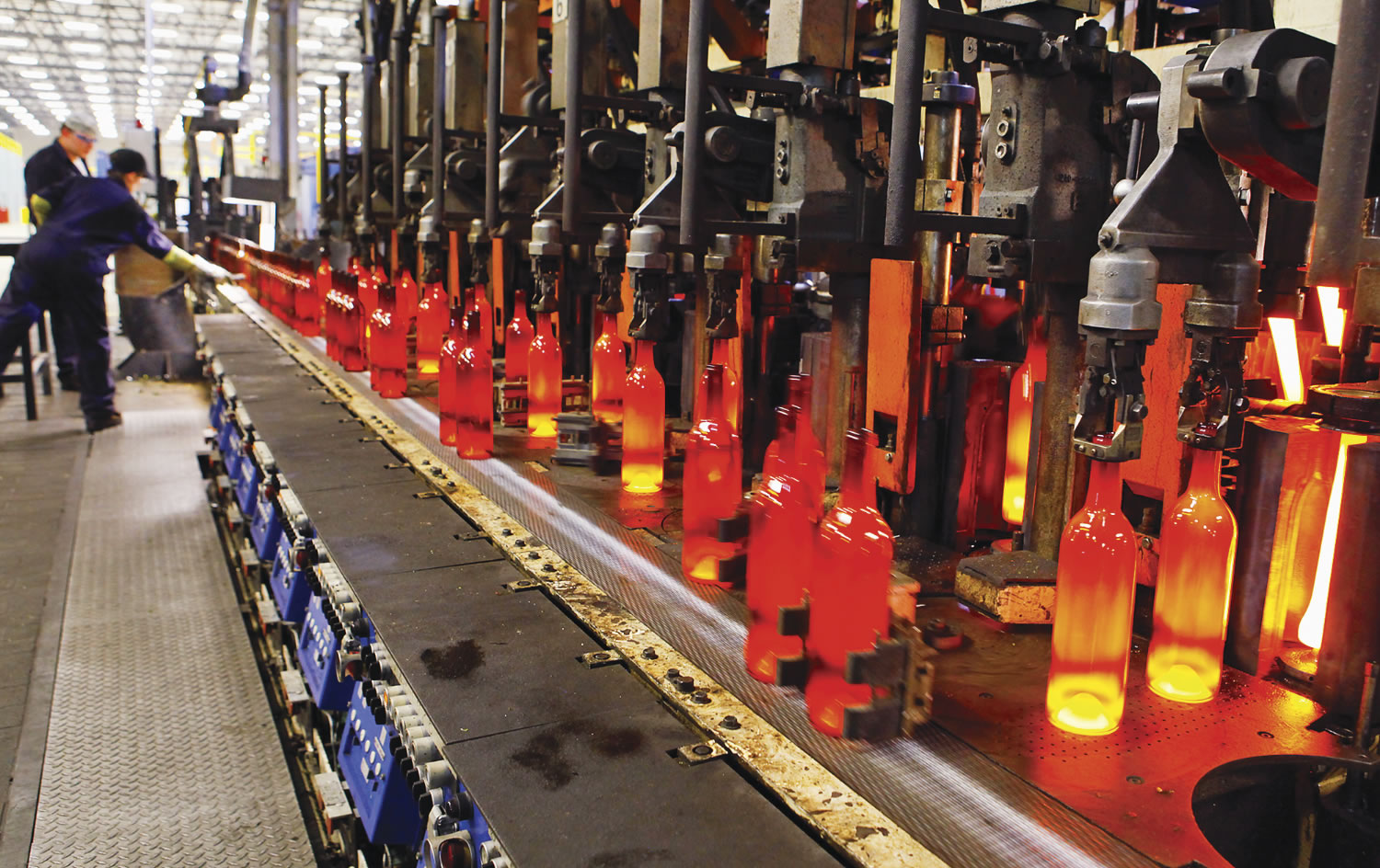 Bottles come off the production line red-hot and glowing at the Bennu Glass factory at the Port of Kalama.
