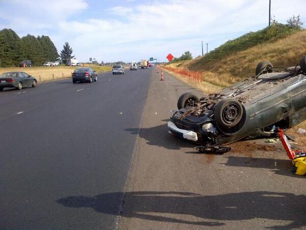 A car rolled onto its top on I-5 southbound, sending three people to the hospital.