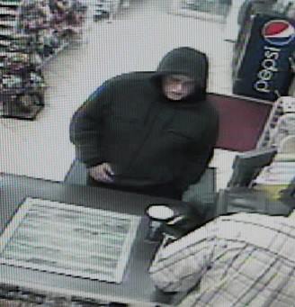 Surveillance footage captured this man, suspected of robbing a convenience store in Clark County.