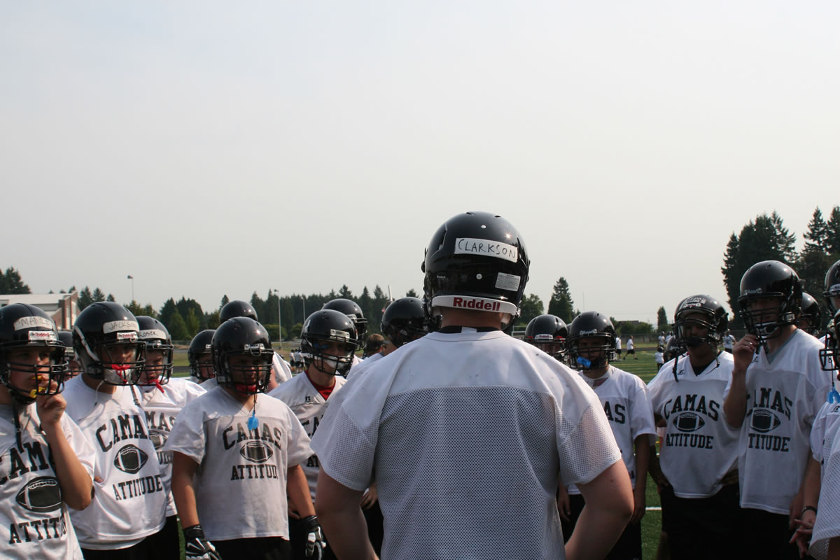 Drew Clarkson leads the Papermakers in a rally cry at the start of football practice Thursday.