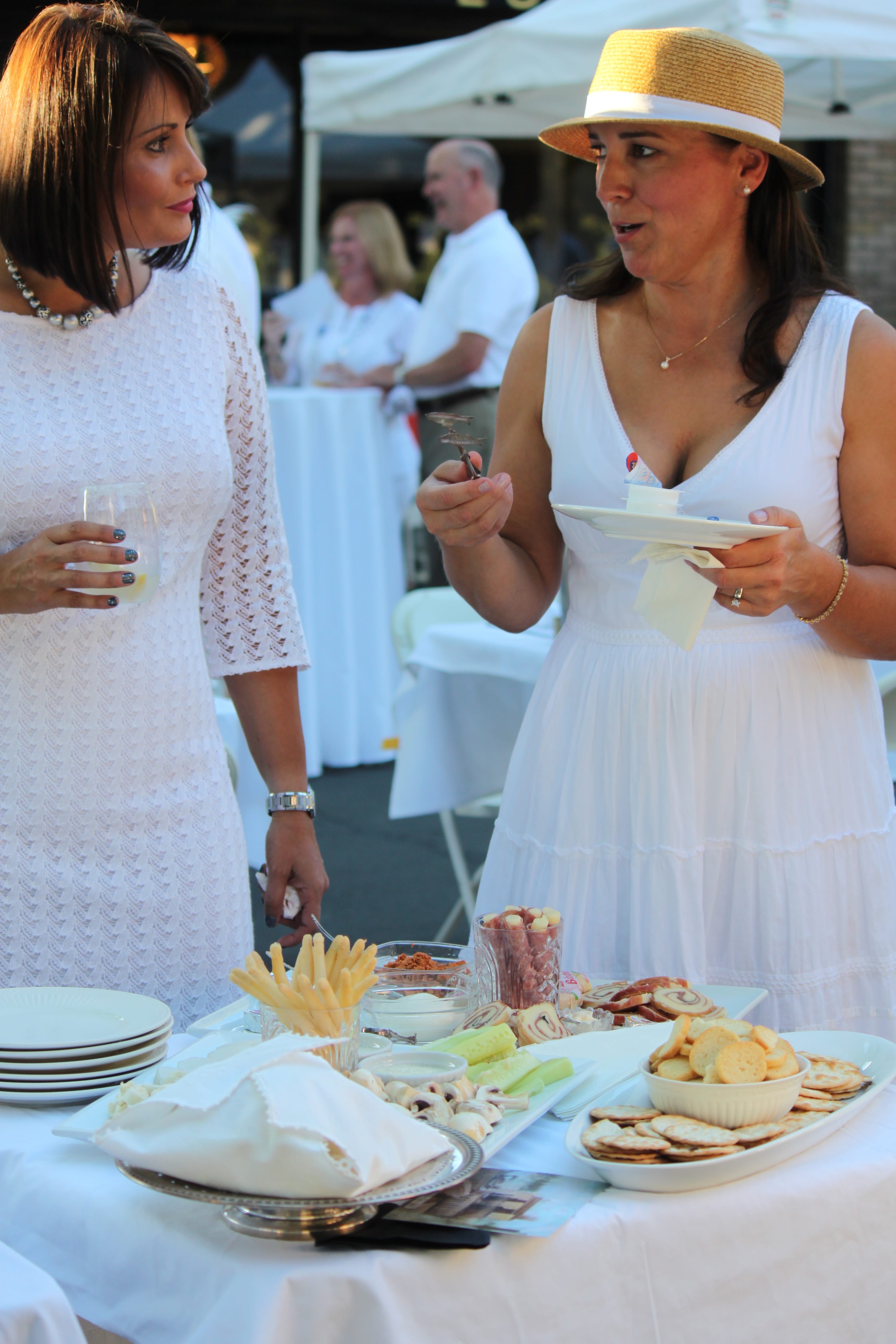 Before dinner, party-goers dined on appetizers and cocktails. The meal began with a traditional napkin wave at 7 p.m. The &quot;diner en blanc&quot; concept was first made famous in Paris. Similar events are now held throughout Europe, and in U.S.
