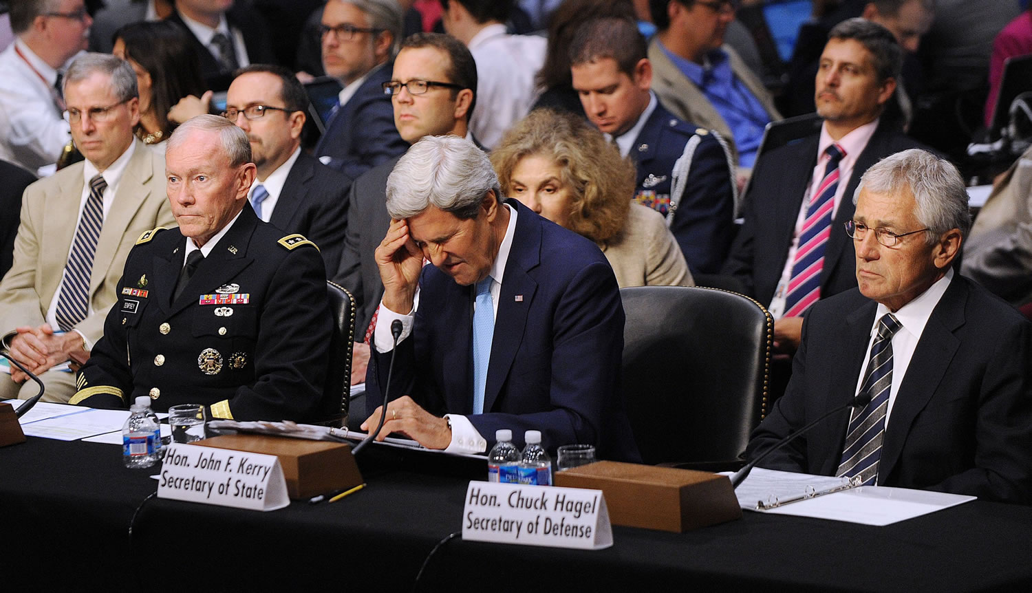 Chairman of the Joint Chief of Staff General Martin Dempsey, left, Secretary of State John Kerry, center, and Defense Secretary Chuck Hagel testify at the Senate Foreign Relations Committee on Tuesday to argue the Obama administration's case for using military force in Syria.