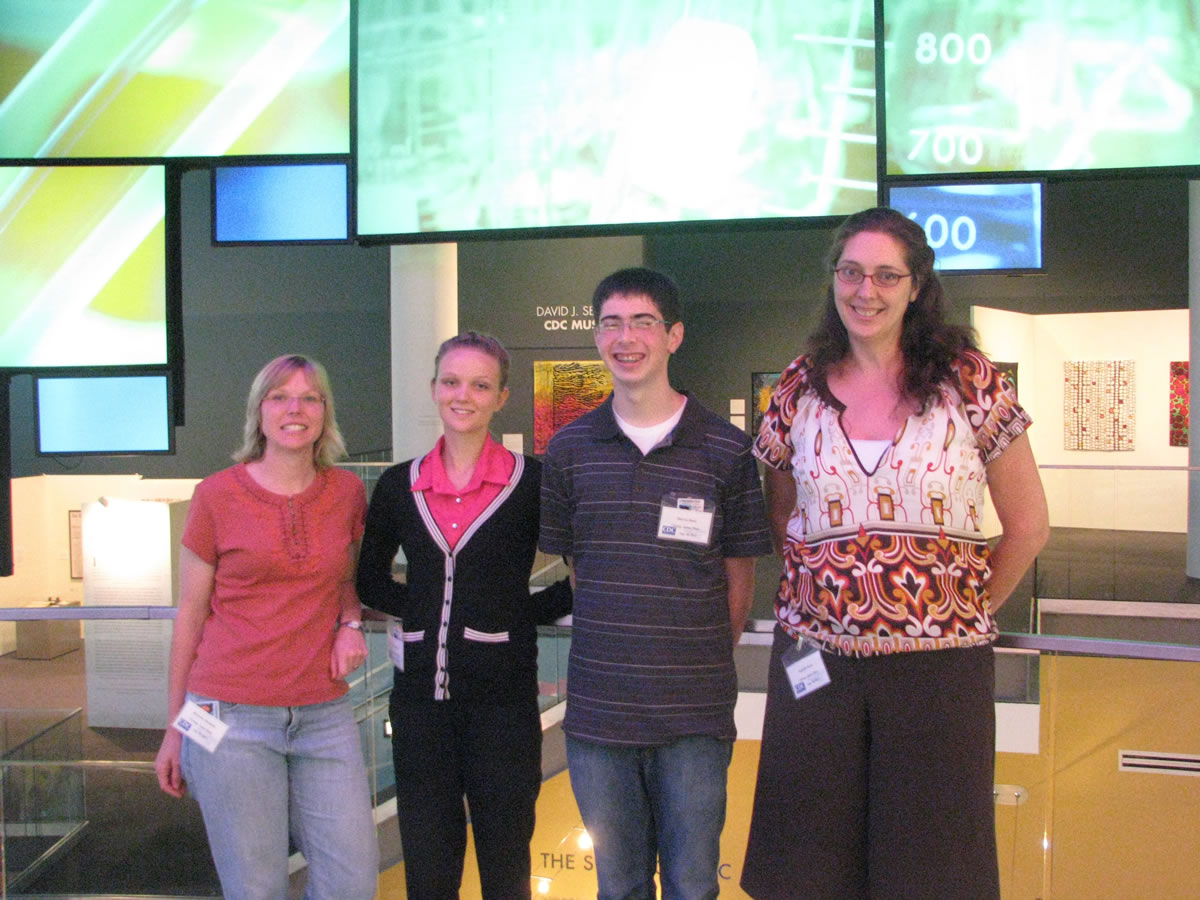 From left, Brianna Abraham, Rachel Fadlovich, Marcus Bintz and Jennifer Dean pose for a photo at the Centers for Disease Control and Prevention  in Atlanta.