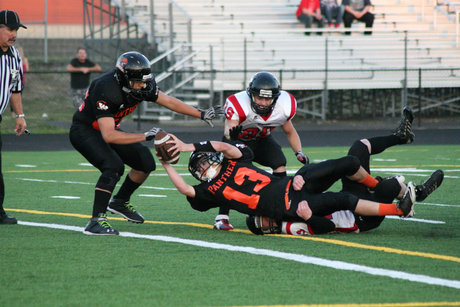 Brandon Casteel (13) gets the football across the goal line for a Washougal touchdown Friday, at Fishback Stadium.