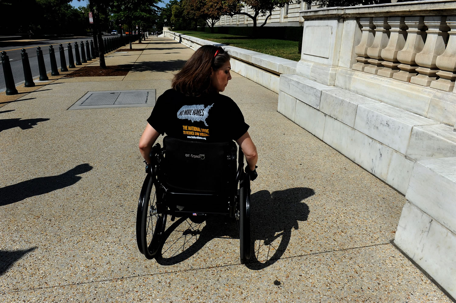 Shooting victim Jennifer Longdon of Phoenix, Ariz., left a Washington rally, which included some of the latest survivors of a mass shooting, to go to the Russell Office Building to try to meet her Senator, Jeff Flake, R-Ariz.