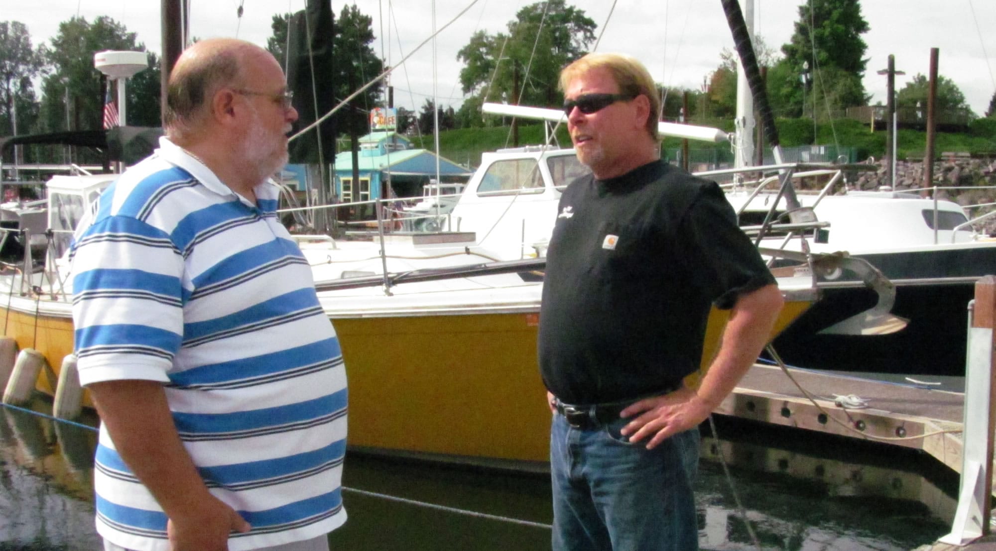 Mark Hamrick, Port of Camas-Washougal harbormaster (right) chats with Tom Welinski, of Camas (left), at the port marina. In August, Hamrick provided transportation and assistance when Welinski pulled a muscle in his back while sailboating. Hamrick said every day brings a new challenge. &quot;You never really know what's going to happen when you go to work or when you're not there for that matter,&quot; he said. &quot;Your phone can ring at any time for almost anything. It can get exciting at times, or go for days or weeks without an event.&quot; Hamrick was hired by the port in 2005, in the role of maintenance assistant.