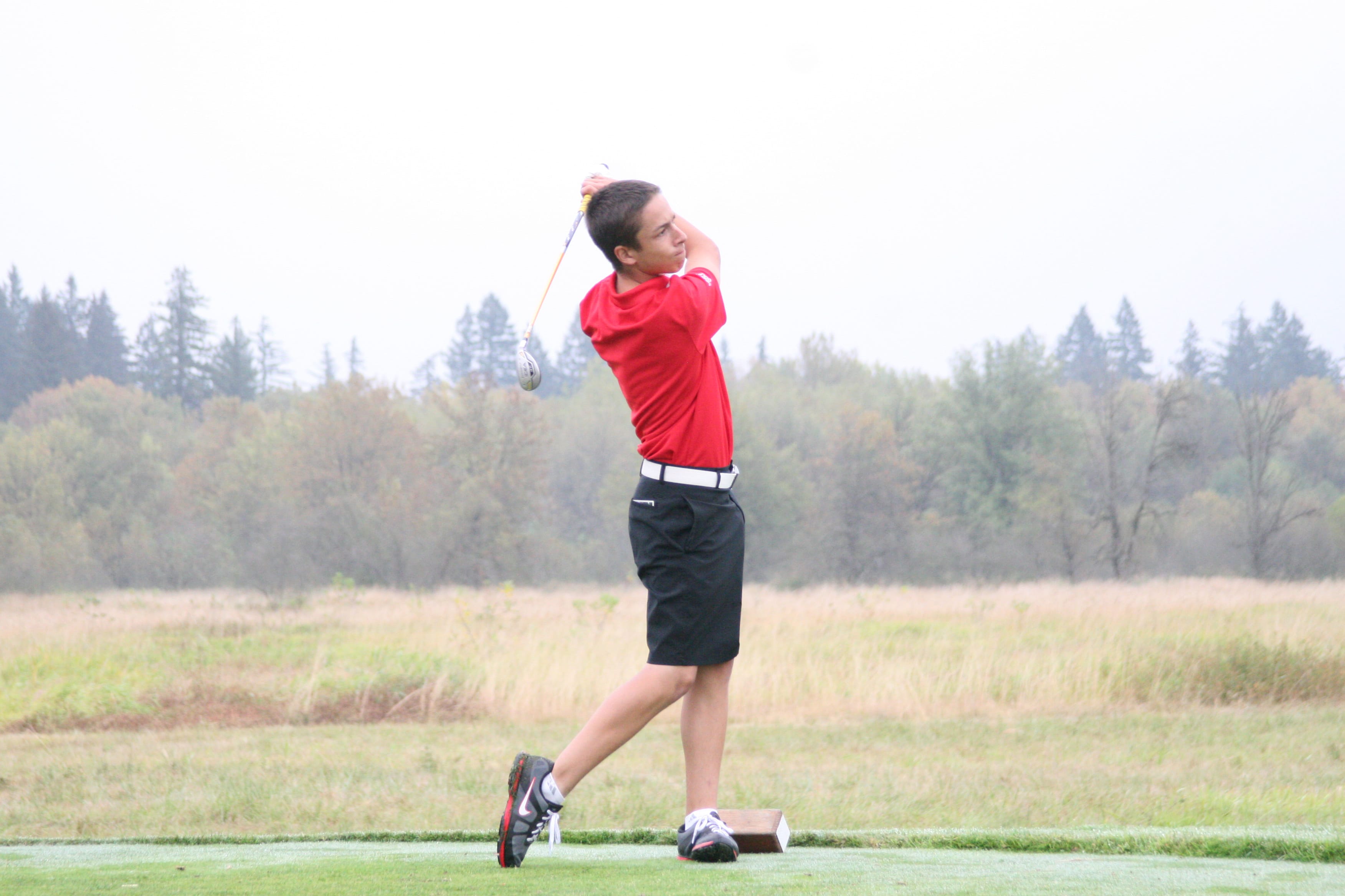 Braeden Campbell watches his tee shot sail over the wetlands that surround the Camas Meadows golf course.