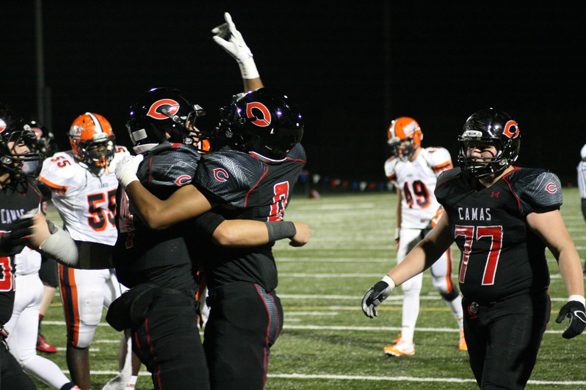 Reilly Hennessey and James Price celebrate after Hennessey scored a touchdown for Camas Friday, at Doc Harris Stadium.