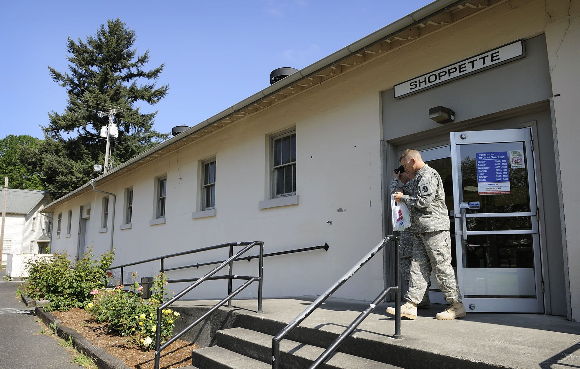 Army reservists walk out of the Vancouver Barracks shoppette in May 2010.