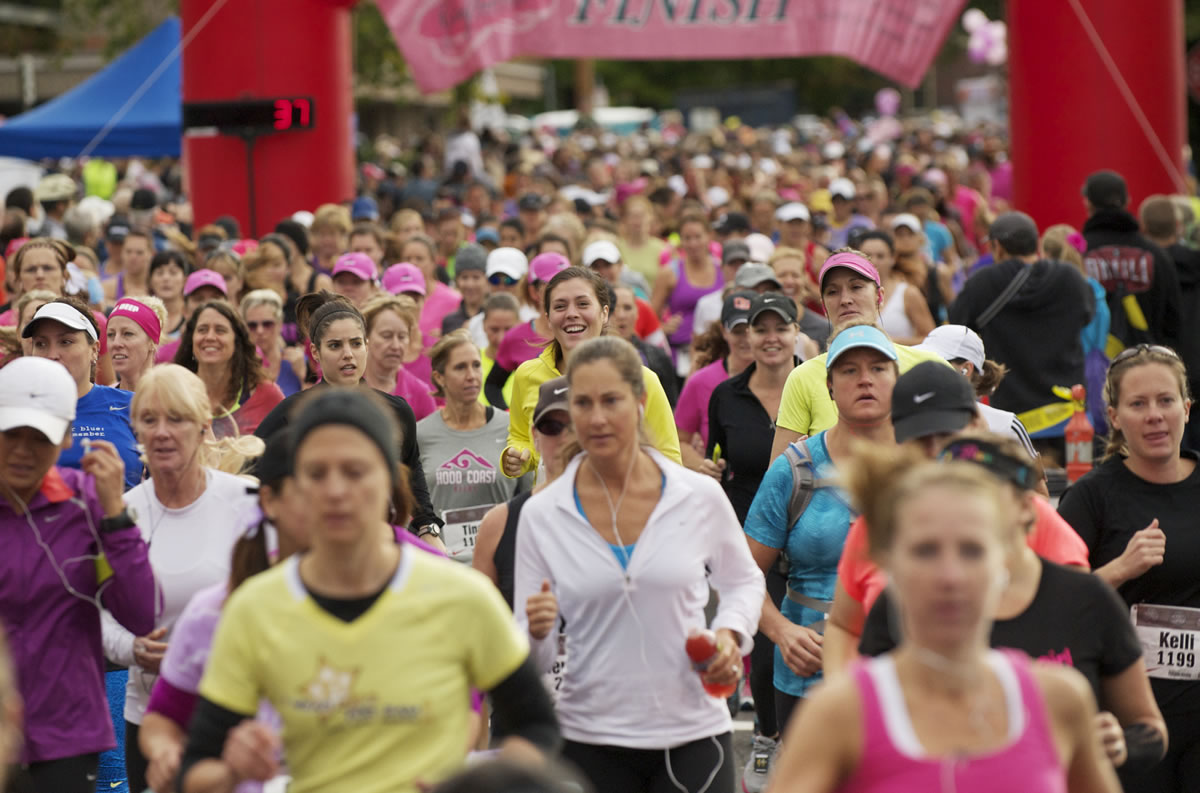 Participants take off from the starting line of the 2012 Girlfriends Half Marathon in downtown Vancouver. In the past six years, the event has raised more than $260,000 for Susan G.