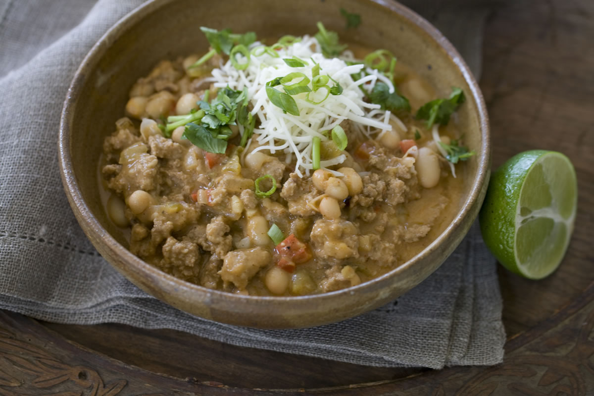 White beans are a good source of fiber -- which means this White Chicken Chili With Lime will fill you up -- and a very good source of folate and manganese.