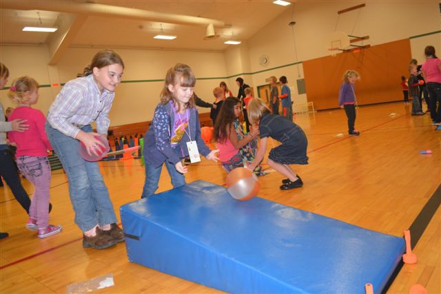 Cape Horn-Skye Elementary student Haleigh Byrd (left) helps Allison Drake during the recent Sport-a-Thon.