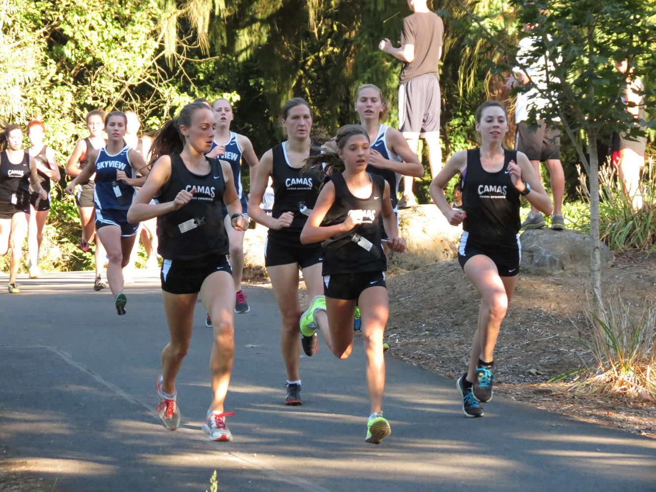 Papermaker runners Alexa Efraimson, Camille Parsons, Maddie Woodson and Alissa Pudlitzke get the upper hand on Skyview Oct. 2, on the Heritage Trail at Lacamas Lake.