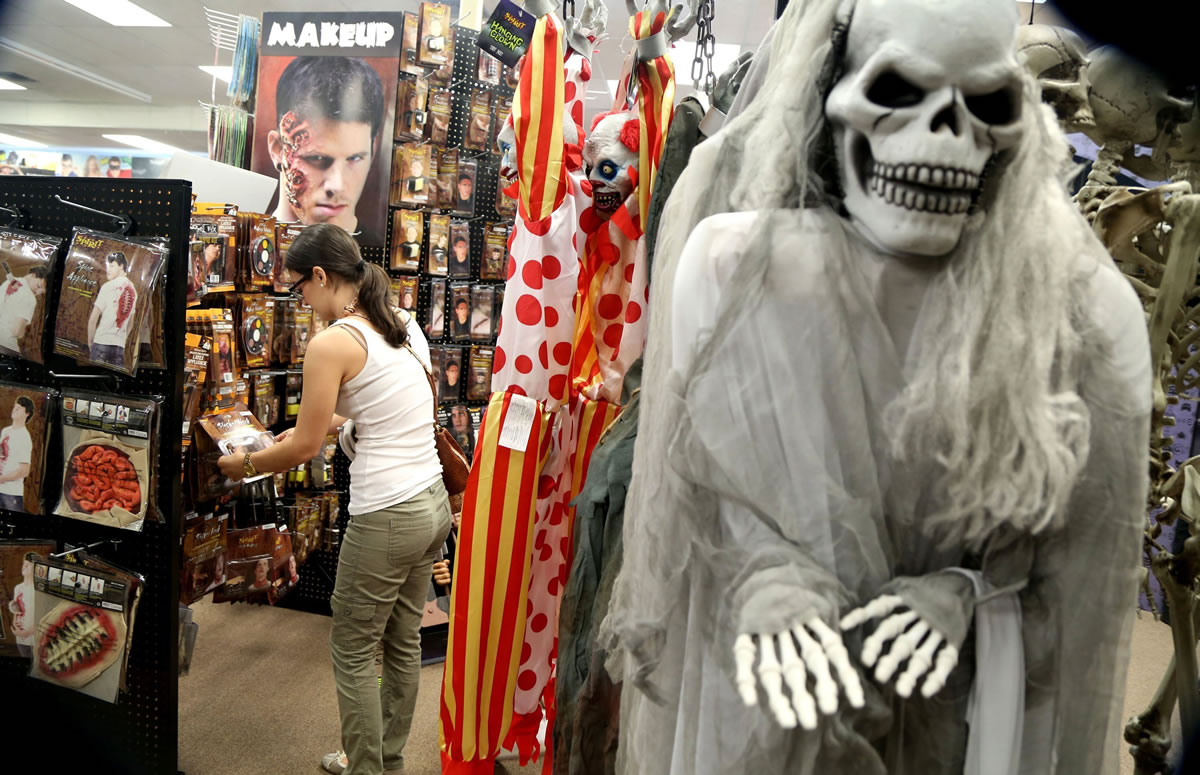 Jessika Jaramillo, of Hollywood, Fla., shops for costume ideas at Spirit Halloween store.