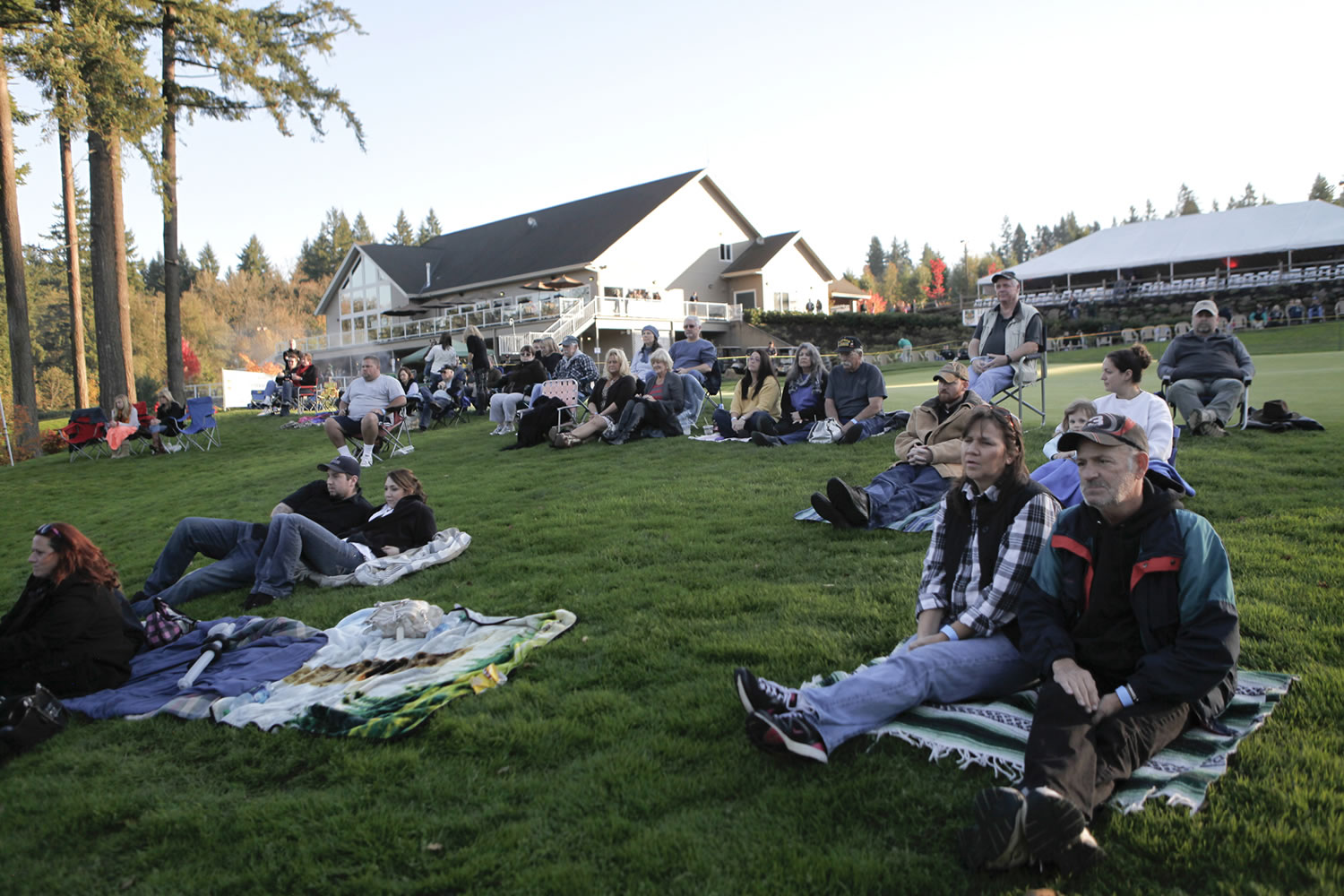 Spectators listen to Livin' Free at a Camas Meadows Golf Course concert at the conclusion of  the three-day weekend for veterans.
