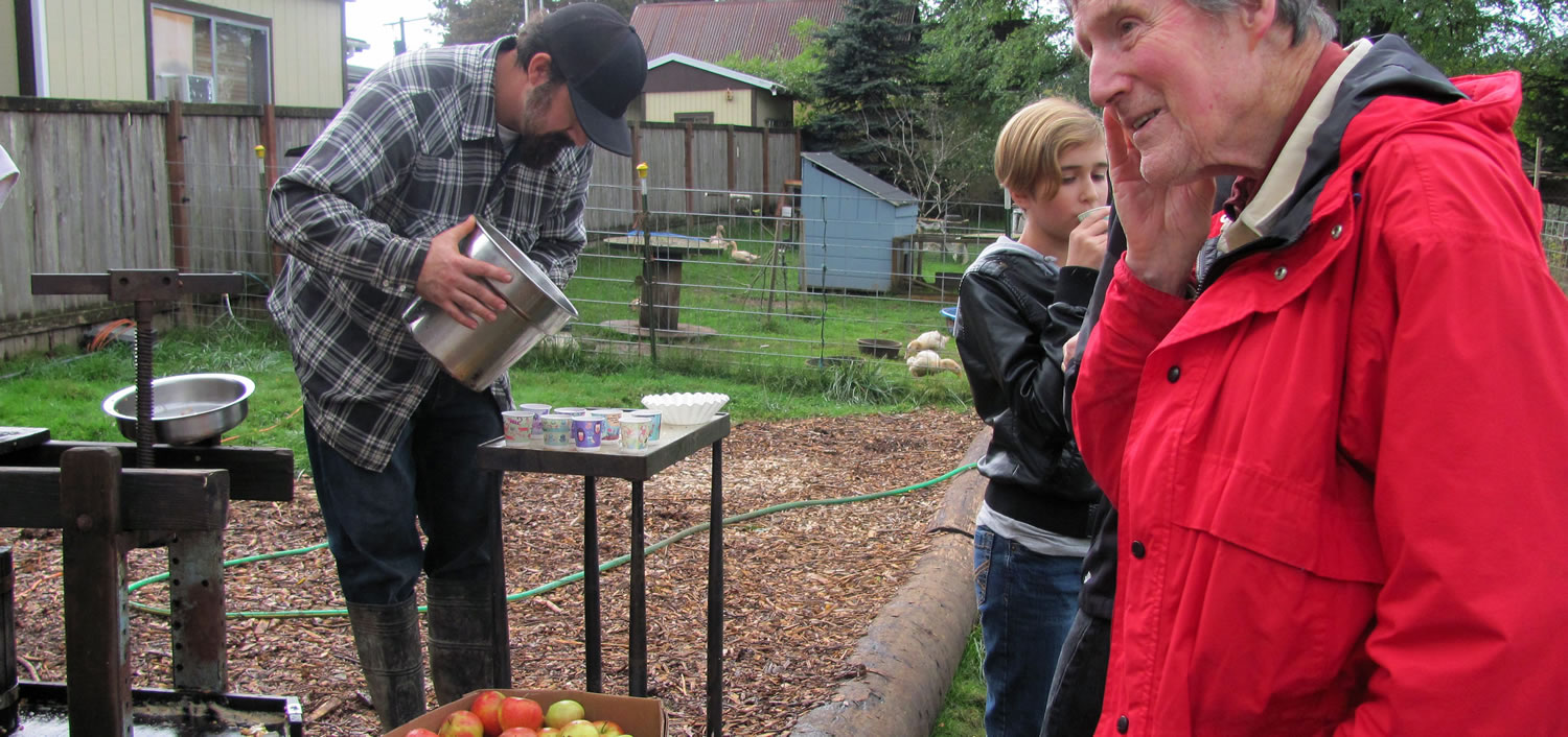 Attendees at Spooky Harvest enjoy homemade apple cider, one of several complimentary treats at the Camas Camp-n-Ranch event.